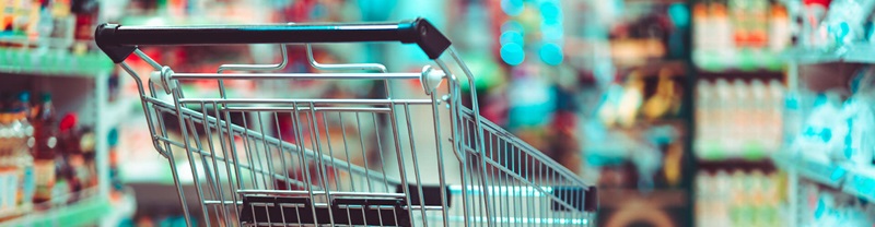 shopping cart in grocery store aisle